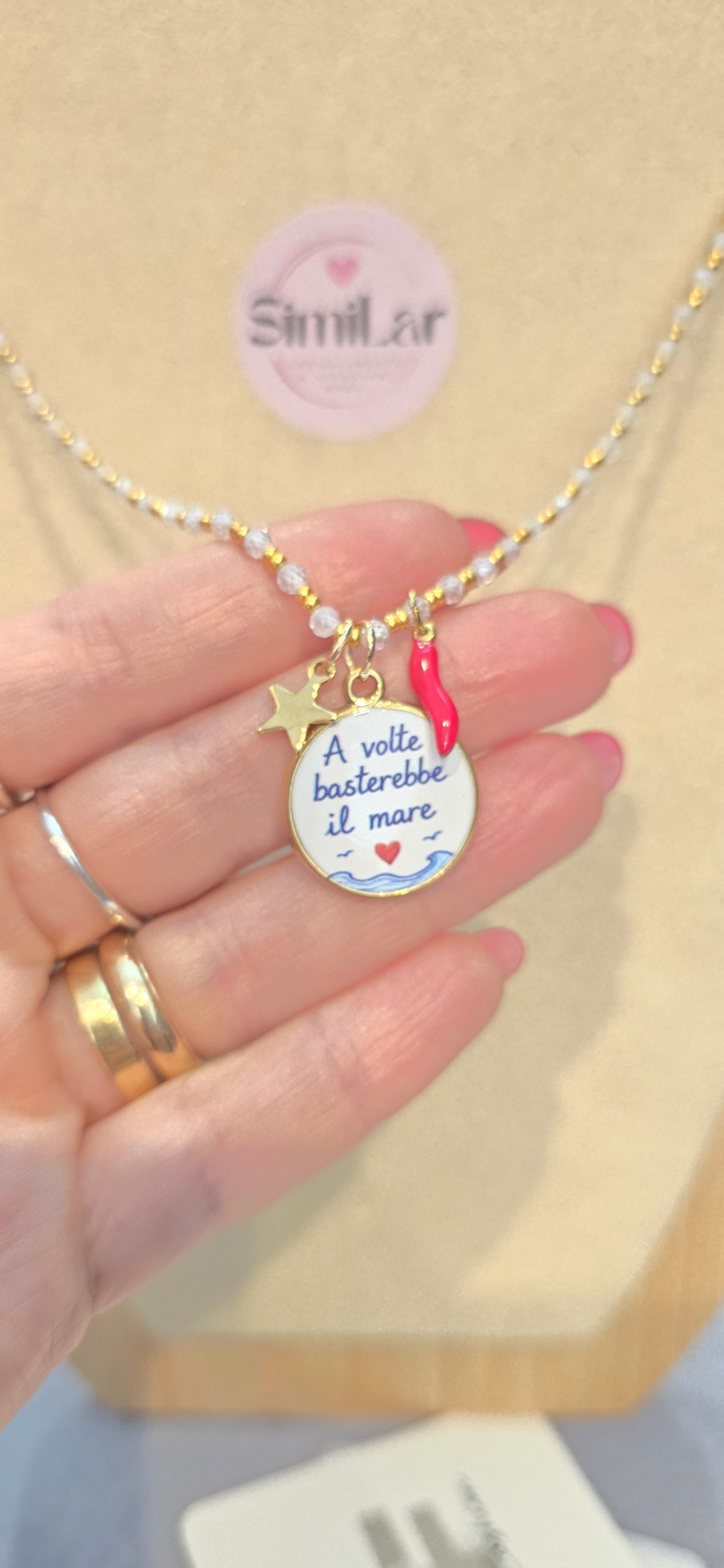 # Collana CRISTALLINI bianca " a volte basterebbe il mare" 3 charms