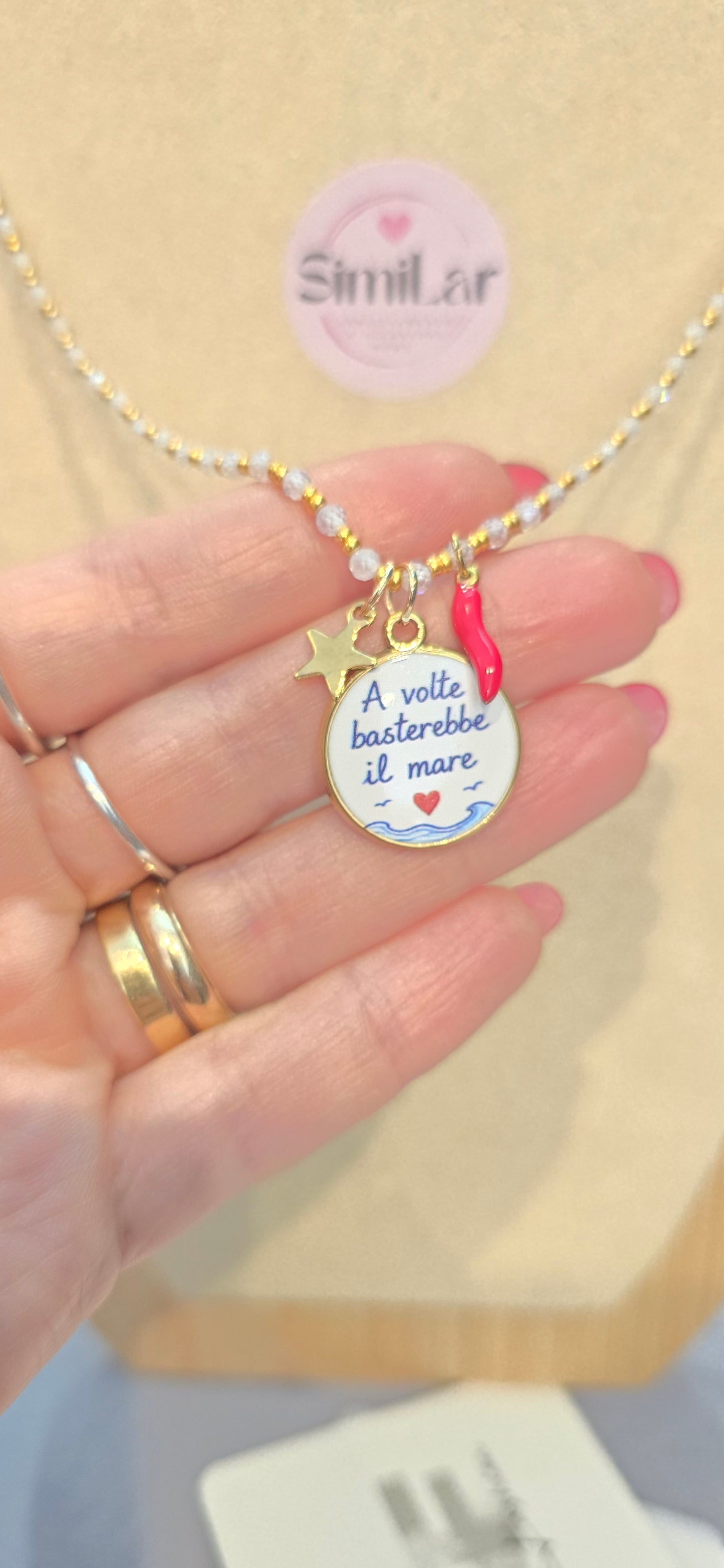 # Collana CRISTALLINI bianca " a volte basterebbe il mare" 3 charms
